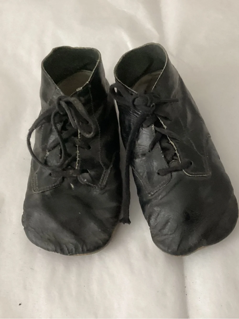Antique children’s pair of black leather lace-up shoes/boots.  high-top ankle